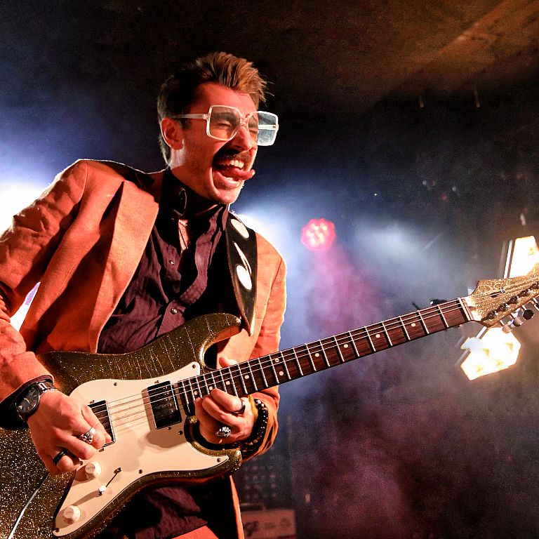 Krissy Matthews   About Krissy  It all started in 1995, when a three-year-old Krissy Matthews was invited on stage by his father to play along to Roy Orbison's Pretty Woman. Nobody in that room could have predicted what would follow.  Now 33, Krissy ha